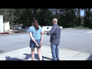 Paige Erin Turner is arrested, handcuffed and shackled then walked to jail. She asks for a female officer to frisk her. The female officer gropes her.