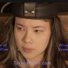 Olive Yeung on set for Torvea Films movie. This is a closeup of her face. She is wearing an electric chair head piece.