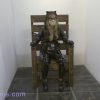 Woman in Gas chamber wearing a cat woman outfit. A Torvea Films moive
